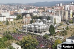 FILE - People protest against Kosovo President Hashim Thaci's border change proposal deal with Serbia in Pristina, Kosovo, Sept. 29, 2018.