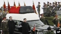 TV image made from KRT video shows Kim Jong Un, Kim Jong Il's youngest son and successor as he walks next to his father's hearse during a funeral procession for the late North Korean leader in Pyongyang, December 28, 2011.