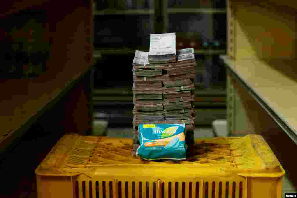 A package of sanitary pads is pictured next to 3,500,000 bolivars, the equivalent of $0.53.