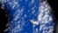 An image taken from a Royal New Zealand P-3 Orion shows a piece of unknown debris floating just under the water while the plane was searching for missing Malaysia Airlines Flight MH370 in the southern Indian Ocean, Australia.