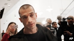 FILE - Russian performance artist Pyotr Pavlensky arrives at the Paris courthouse, Jan. 10, 2019. 