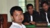 30 year-old Indonesian Alexander Aan listens to the judges delivering his verdict in West Sumatra, June 14, 2012.