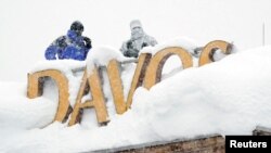 Snipers hold their position on the roof of a hotel during the World Economic Forum (WEF) annual meeting in the Swiss Alps resort of Davos, Switzerland, Jan. 22, 2018. 