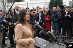 White House press secretary Sarah Sanders speaks to reporters outside the White House in Washington, April 2, 2019.