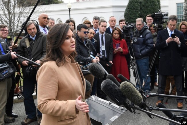 White House press secretary Sarah Sanders speaks to reporters outside the White House in Washington, April 2, 2019.