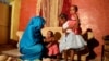 Youssria Awad plays with her daughters in their home, in Khartoum, Sudan on June 14, 2020. She refuses to carry out female genital mutilation on them, a practice that involves partial or total…