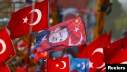 A flag with the picture of Turkey's President Tayyip Erdogan is seen during an August 7, 2016, rally organized by him and allies after a failed military coup. (Osman Orsal/Reuters)