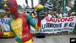 Malians living in Ivory Coast protest against a coup in their country, during the Extraordinary Meeting of ECOWAS, in Abidjan, March 27, 2012.