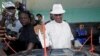 Joseph Nyuma Boakai, Liberia's vice president and presidential candidate of Unity Party (UP), votes at a polling station in Monrovia, Liberia.