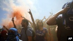 People protest during an anti-government demonstration in Santiago, Chile, Oct. 24, 2019. 