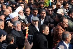 Иракский премьер-министр Адиль Абдель Махди прибыл на похороны Сулеймани и аль-Мухандиса в Багдаде, 4 января 2020 года