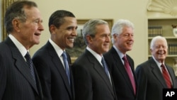 President George W. Bush (center) poses with President-elect Barack Obama, and former presidents, from left, George H.W. Bush, left, Bill Clinton and Jimmy Carter, Jan. 7, 2009, in the Oval Office of the White House in Washington.