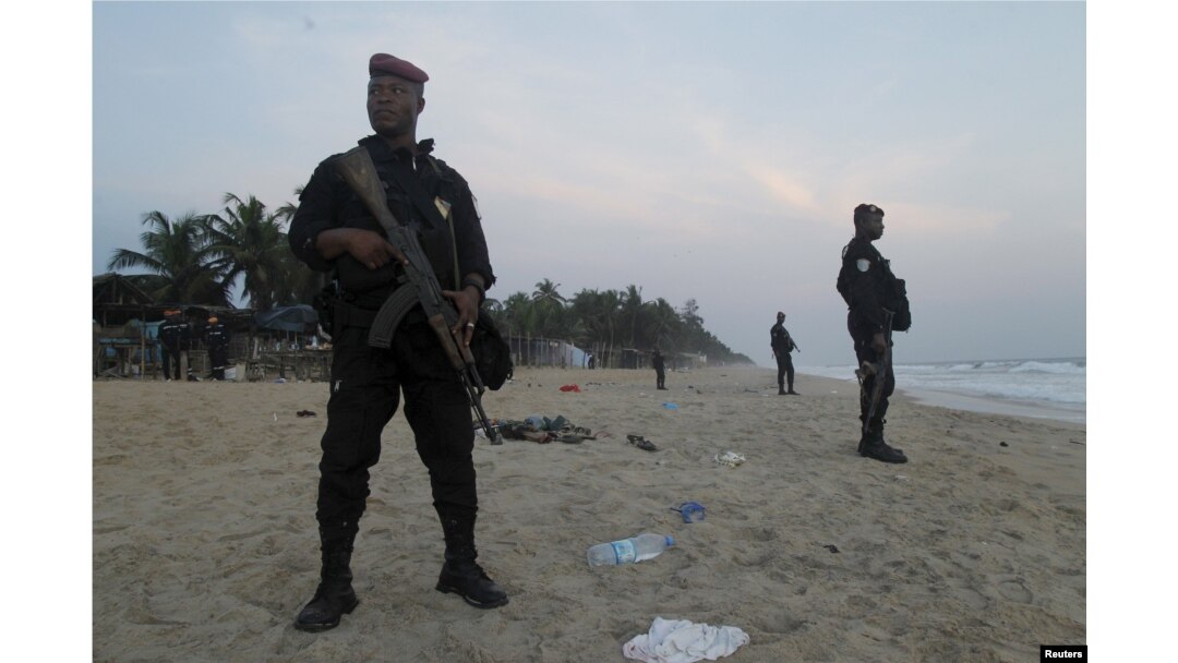 Soldiers stand in guard on the beach in Grand Bassam, Ivory Coast, after a terrorist attack on a resort there March 13, 2016.