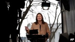 White House press secretary Sarah Huckabee Sanders speaks during a television interview outside the White House in Washington, Jan. 22, 2018, on the third day of the federal shutdown. 