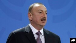 FILE - Azerbaijan President Ilham Aliyev announced an amnesty March 19 that resulted in the pardoning and release of two jailed opposition activists, yet some still say the country is bent on silencing critical voices.