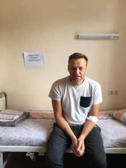 A handout image made available on the official website of Russia's opposition leader Alexei Navalny (Navalny.com) on July 29, 2019, shows Russia's jailed opposition leader Alexei Navalny sitting on a hospital bed in Moscow.