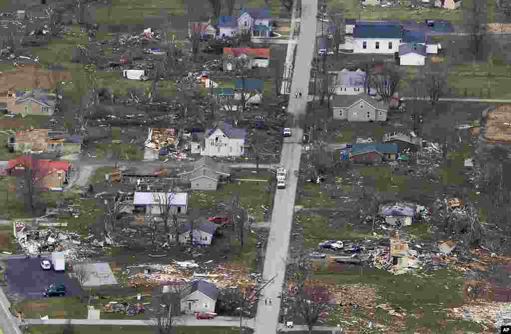 Several homes lie demolished next to other homes that were untouched, March 3, 2012, in Holton, Indiana, by a tornado that swept along the main street. (AP)