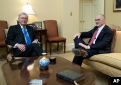 Senate Majority Leader Mitch McConnell meets Andy Puzder (right) before Puzder withdrew Wednesday as President Trump's labor secretary nominee.