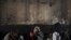 FILE - Afghan drug addicts use drugs under a bridge in Kabul, Feb. 7, 2011. 