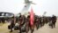 中国军队医护人员乘坐军机抵达武汉天河国际机场。(2020年2月2日)