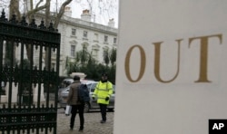 FILE - A van pulls into the grounds of the Russian Embassy in London, March 20, 2018.