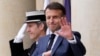 French President Emmanuel Macron waves to photographers after a meeting with the President of the Democratic Republic of the Congo at the Elysee Palace in Paris on April 30, 2024. (Photo by Christophe Ena / POOL / AFP)