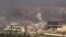 This frame grab from video provided by the government-controlled Syrian Central Military Media, shows smoke rising during fighting between insurgents and Syrian government troops, in an eastern neighborhood of Damascus, Syria, March. 22, 2017. 