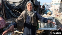 A woman reacts at the site of an Israeli strike on a tent housing displaced people, at Al-Aqsa Martyrs Hospital in Deir Al-Balah, in the central Gaza Strip, Nov. 9, 2024.