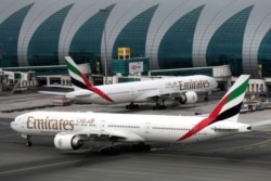 FILE PHOTO: Emirates Airline Boeing 777-300ER planes are seen at Dubai International Airport in Dubai, United Arab Emirates, February 15, 2019. REUTERS/Christopher Pike/File Photo