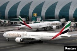 FILE - Emirates Airline Boeing 777-300ER planes are seen at Dubai International Airport in Dubai, United Arab Emirates, February 15, 2019. (REUTERS/Christopher Pike/File Photo)