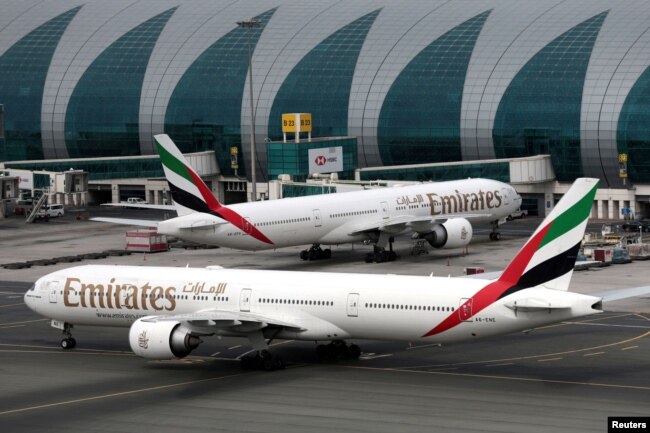 FILE - Emirates Airline Boeing 777-300ER planes are seen at Dubai International Airport in Dubai, United Arab Emirates, February 15, 2019. (REUTERS/Christopher Pike/File Photo)