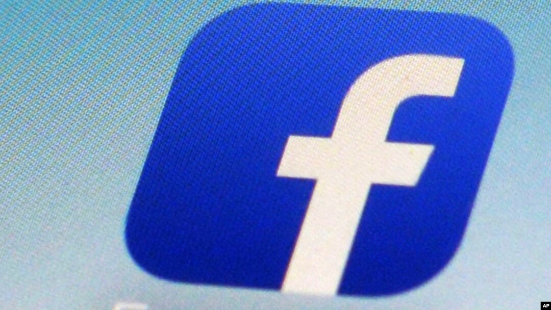 FILE - A Facebook app icon is seen on a smartphone in New York.