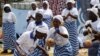 File - Members of the Women In Peacebuilding Network dance, sing and pray in anticipation of the nation soon being declared Ebola-free, in Monrovia, Liberia, May 2015. 