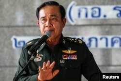 Thai Army chief General Prayuth Chan-ocha gestures during a news conference at the Thai Army Club after the army declared martial law nationwide to restore order in Bangkok, Thailand, May 20, 2014.