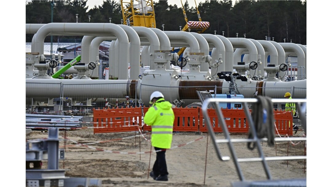 FILE - Men work at the construction site of the so-called Nord Stream 2 gas pipeline in Lubmin, northeastern Germany, March 26, 2019.