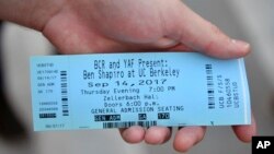 A spectator holds a ticket for a speaking engagement by Ben Shapiro on the campus of the University of California Berkeley in Berkeley, Calif., Sept. 14, 2017.