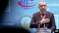 Turkey's President Recep Tayyip Erdogan speaks as he inaugurates a new aviation hub in Istanbul, Oct. 29, 2018.