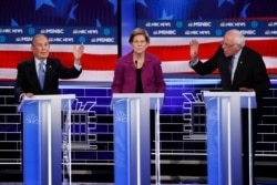 From left, Democratic presidential candidates, former New York City Mayor Mike Bloomberg, Sen. Elizabeth Warren, D-Mass., Sen. Bernie Sanders, I-Vt., participate in a Democratic presidential primary debate, Feb. 19, 2020, in Las Vegas.