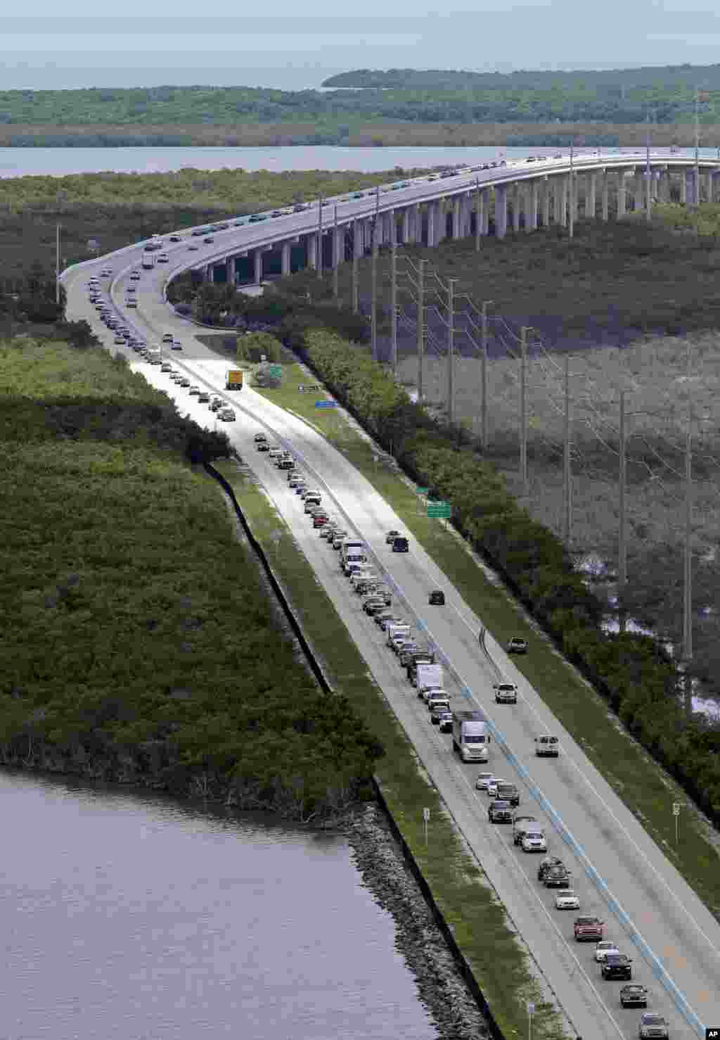 Motorists head north on US 1, Sept. 6, 2017, in Key Largo, Fla., in anticipation of Hurricane Irma. Keys officials announced a mandatory evacuation Wednesday for visitors, with residents being told to leave the next day. 