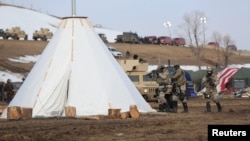 The U.S. National Guard attempt to clear the Oceti Sakowin camp near Cannon Ball, North Dakota, Feb. 23, 2017.