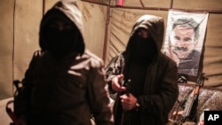 Militants of the Kurdistan Workers' Party, or PKK, stand in a bunker in Sirnak, Turkey, Dec. 23, 2015.