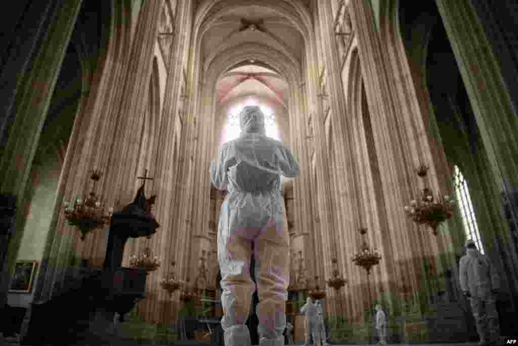 Journalists and employees of the DRAC (Regional Directorate of Cultural Affairs) visit the Cathedral of St. Peter and St. Paul of Nantes, western France, almost one year after it was severely damaged by a fire.