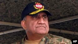FILE - Pakistan's Qamar Javed Bajwa attends a military exercise in Khairpur Tamiwali, Pakistan, Nov. 16, 2016.