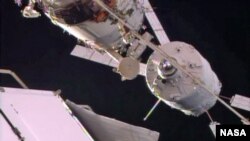 The Automated Transfer Vehicle holds for checks just a few feet away from docking to the Zvezda service module.