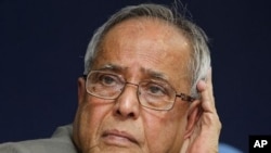 Indian Finance Minister Pranab Mukherjee listens to a question during a press conference in New Delhi, India, January 25, 2011