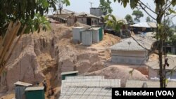 Some Rohingya shacks on the slope of a hill in a refugee camp in Balukhali, Cox's Bazar, Bangladesh. The aid agencies are working to relocate refugees from such landlide-prone areas to safer flatlands.