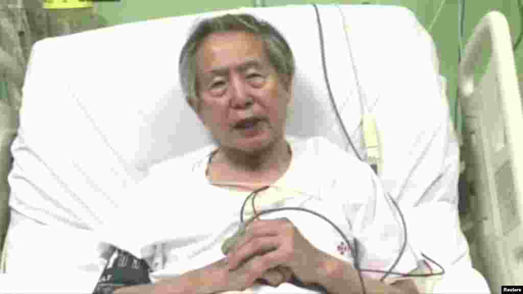 Peru's former President Alberto Fujimori asks for forgiveness from Peruvians as he lies in hospital bed in Lima, Peru, in this still image taken from a video posted on Facebook.