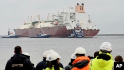 FILE - The giant liquefied natural gas tanker Al Nuaman, carrying 200,000 cubic meters of liquefied gas from Qatar, arrives at Swonoujscie, Poland, Dec. 11, 2015.