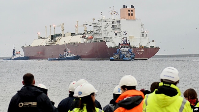 FILE - The giant liquefied natural gas tanker Al Nuaman, carrying 200,000 cubic meters of liquefied gas from Qatar, arrives at Swonoujscie, Poland, Dec. 11, 2015.