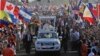 Pope Francis waves from his popemobile as he arrives to celebrate an early morning Mass at the metro park Campo San Juan Pablo II in Panama City, Jan. 27, 2019. 